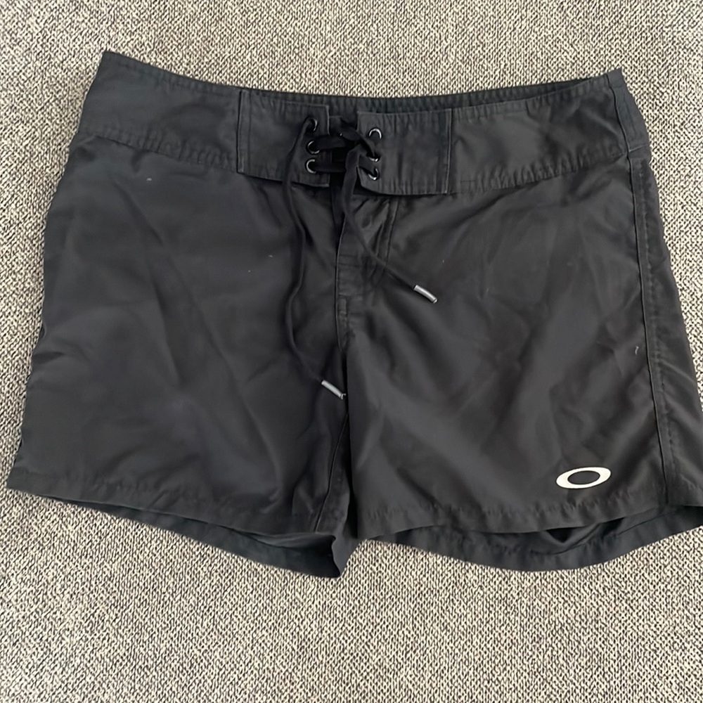 Oakley black water shorts size 1/2. 15” waist, 5” inseam.